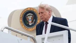 U.S. President Donald Trump disembarks Air Force One, at Joint Base Andrews,