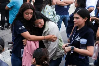 People react after evacuating the Biblioteca Nacional in San Salvador, El Salvador, on Friday. Photo: Reuters