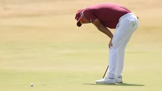 Lucas Herbert bends over in disappointment after missing his par putt on the 18th at Royal Birkdale