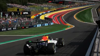 A rear view of the Racing Bulls of Liam Lawson approaching the uphill Eau Rouge corner during Belgian Grand Prix qualifying