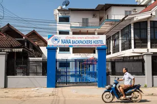 A motorcyclist passes the Nana Backpackers Hostel in Vang Vieng on November 24, 2024. — AFP pic