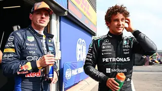 Max Verstappen and Kimi Antonelli stood in the pit lane after qualifying for the Belgian Grand Prix