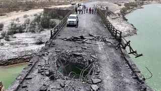 A hole in a damaged bridge in Iran's southern Hormozgan Province on July 17.