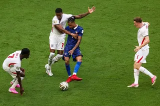 France’s Michael Olise being watched closely by Ezri Konsa and other English players during the World Cup third-place play-off on July 18.