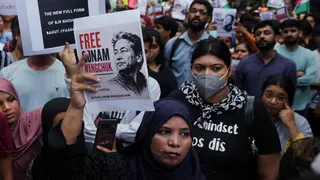 Supporters of the Cockroach Janta Party (CJP) hold posters of Sonam Wangchuk after authorities moved him to a hospital during his hunger strike, during a protest demanding the resignation of Indian Education Minister Dharmendra Pradhan, in Mumbai, India, July 19, 2026.