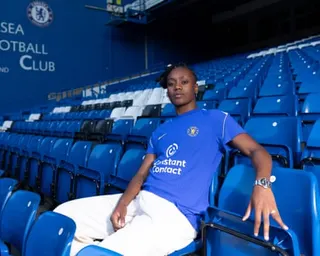 Melvine Malard poses in the stands at Stamford Bridge after signing for Chelsea