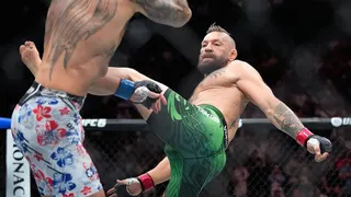 Conor McGregor kicks Max Holloway in a UFC fight in Las Vegas.