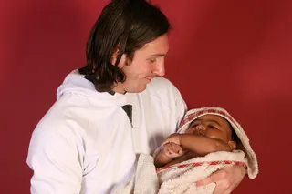 Lionel Messi cradles a baby Lamine Yamal in a bath in the away dressing room at Barcelona's Camp Nou stadium in 2007