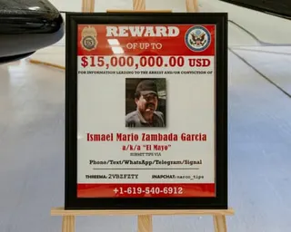 a reward sign for a wanted man is displayed
