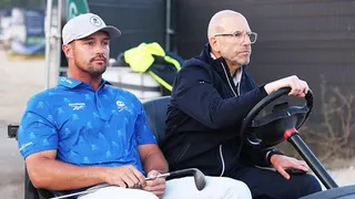 Bryson DeChambeau rides in a buggy at Royal Birkdale.
