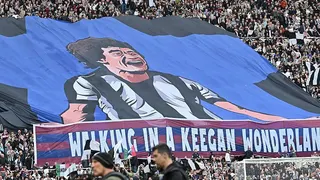 Newcastle fans unveil a large Kevin Keegan flag with the message "Walking in a Keegan wonderland"