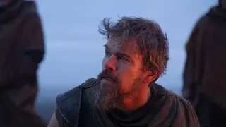 Matt Damon as Odysseus looking off screen against a blue background.