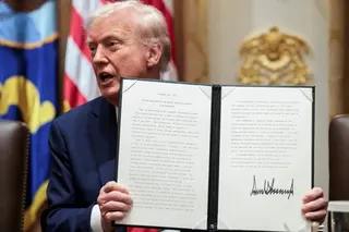 US President Donald Trump displays an executive order launching the AI-focused Genesis Mission on November 24, 2025. Photo: Reuters