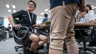 Japanese men in the office wearing shorts