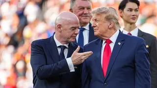 Gianni Infantino, Donald Trump, Claudia Sheinbaum and Mark Carney stand during an awards ceremony.