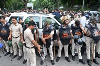 Police stand guard at a sit-in protest calling for prime minister Narendra Modi’s resignation outside his residence in Delhi on Tuesday.