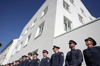 Police officers outside the building where Adolf Hitler was born. Photo: Reuters