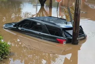 a car submerged in floodwater