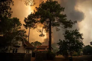 Officials and residents said the fire appeared to have been started by a brush-clearing machine.