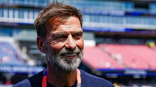Head and shoulders view of Jurgen Klopp, with brown hair and grey beard, and blue T-shirt