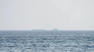 Vessels float in the Strait of Hormuz.