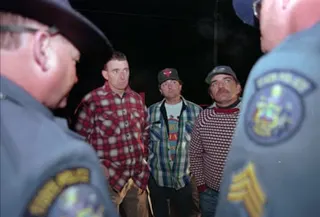 three men side by side