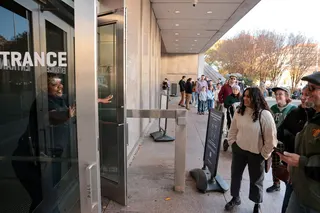 A guard welcomes visitors to the Smithsonian’s National Museum of American History in Washington last year. Photo: Reuters