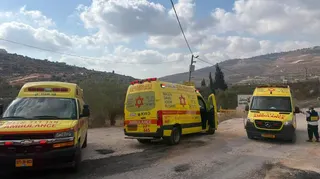 Three yellow ambulances parked at scene of West Bank shooting incident (24/07/26)
