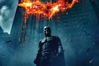 The Dark Knight poster (center crop) - Batman with flaming bat signal on building behind him