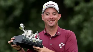 Lucas Herbert of Australia poses with his individual trophy after the final round of LIV Golf United Kingdom