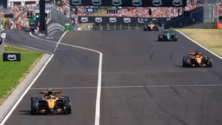 Lando Norris comes out of the pits ahead of McLaren team-mate Oscar Piastri