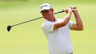 Lucas Glover of the United States hits an approach shot