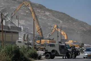 Israeli army bulldozers demolish a Palestinian building in the West Bank village of Anza, Monday, July 27, 2026. [File: Majdi Mohammed/AP]