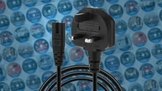 PlayStation 5 power plug over a grid of PS5 discs