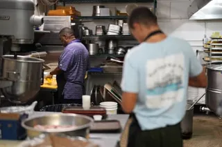 cooks work in a kitchen