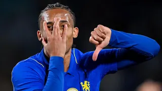 Joao Pedro partly covers his face with his hand