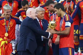 US President Donald Trump and FIFA President Gianni Infantino, left, hand the World Cup trophy to Spain’s Rodri before the 2026 trophy lift