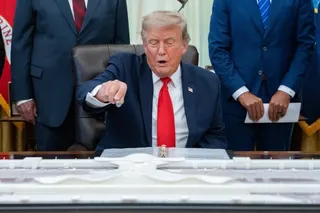 US President Donald Trump points at a model depeciting the proposed overhaul of Washington Dulles International Airport in the Oval Office on Wednesday. Photo: EPA