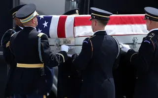 US soldiers carry a casket during a dignified transfer ceremony in Delaware in July