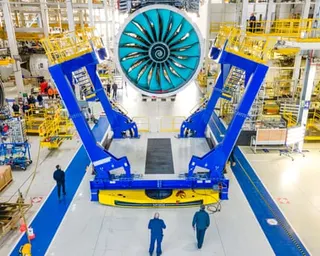A factory floor with an enormous fan at the centre.