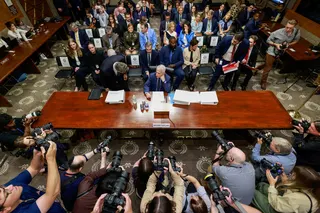 Photographers and Anthony Fauci at the hearing. Photo: AFP