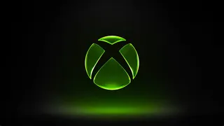 Xbox 3D logo, green on black background.