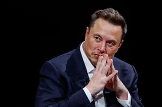 A man with his hands on his mouth.