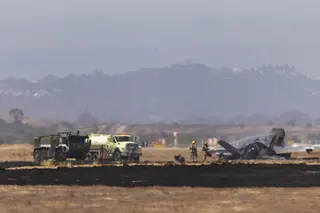 Crews work to douse a F-35 fighter jet that crashed near the runway at Marine Corps Air Station Miramar in San Diego on Friday. Photo: The San Diego Union-Tribune via AP