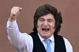 Argentina’s President Javier Milei gestures from the balcony of Casa Rosada presidential palace in Buenos Aires in May. Photo: AFP