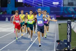 Josh Kerr crosses the line in style on his way to Commonwealth Games gold in the mile in front of jubilant fans in Glasgow.