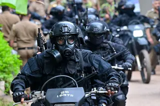 Sri Lankan military personnel in riot gear patrol outside Mahara Prison near Colombo on August 2, 2026 after a riot left one inmate dead and six others injured. — AFP pic