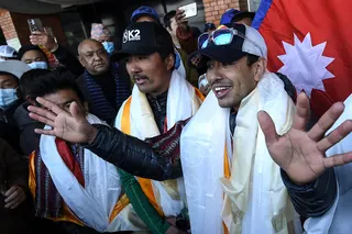 Nirmal Purja talks to the media at the Tribhuvan International airport after becoming the first to summit Pakistan’s K2 mountain in winter on January 26, 2021.Photo: AFP