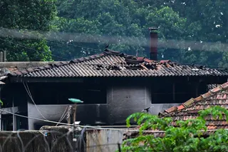 A damaged building is seen on Sunday, a day after a riot at the Mahara Prison complex. Photo:  AFP