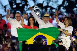 (L to R) Brazil's Vice-President Geraldo Alckmin, Brazil's second lady Maria Lucia "Lu" Alckmin, Brazilian President Luiz Inacio Lula da Silva and First Lady Rosangela "Janja" da Silva hold a Brazilian flag and gesture from a stage during the Workers' Party (PT) national convention in Sao Paulo, Brazil, on August 2, 2026, where Lula formally announces his bid for re-election. At 80, President Lula on July 2 launches his bid for re-election, casting himself as a defender of Brazil's "sovereignty"